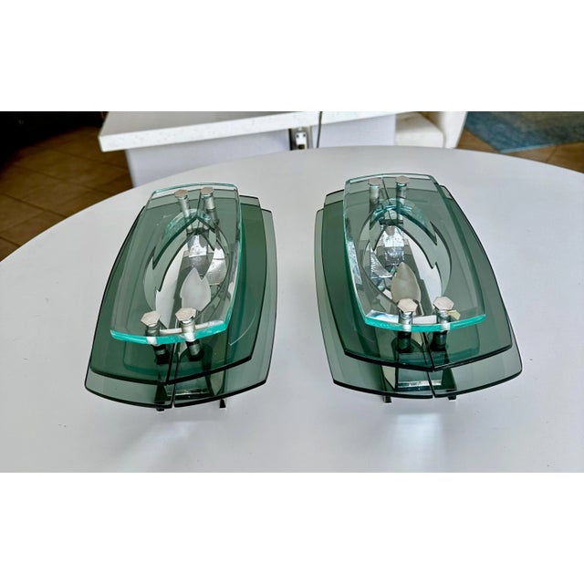 Pair of modern mid century Italian made sconces in the style of Fontana Arte, three layers of translucent shades of...