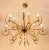Italian mid-century polished gilt brass chandelier with clear glass elements in the holders. This chandelier includes 12...