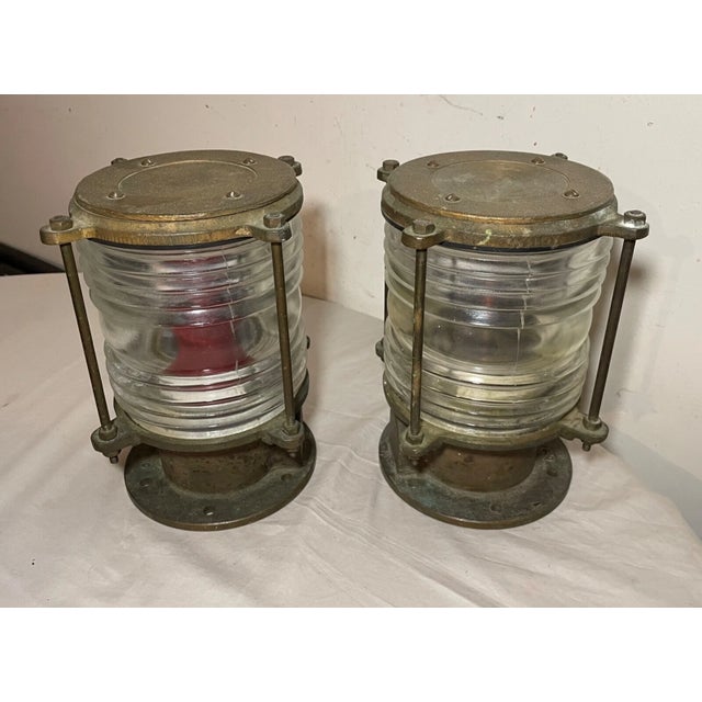 Experience the charm of Oceanic illumination with this pair of solid brass and deck lamps, embodying the spirit of antique...