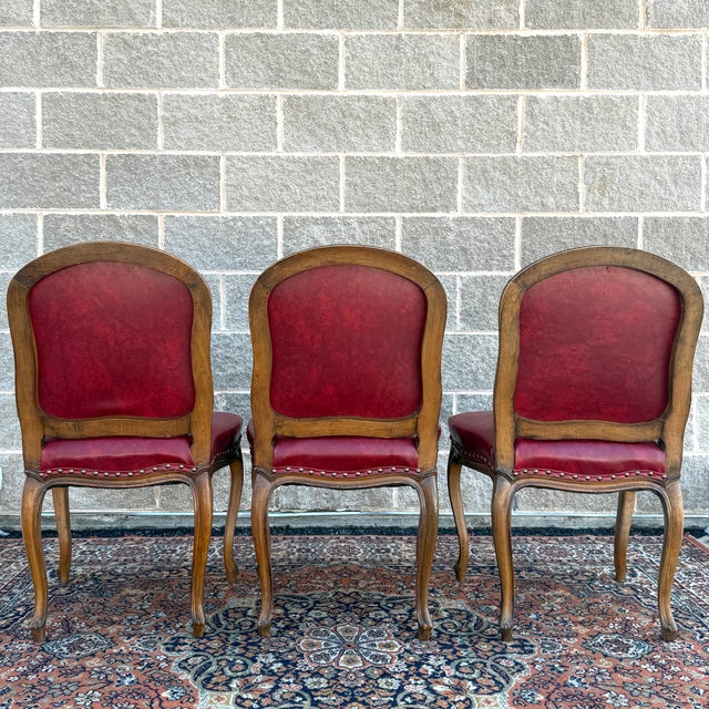 Mid 20th Century Tacked Red Vinyl & Fruitwood French Louis XV Fauteuil Dining Chairs - Set of 3 For Sale - Image 9 of 17