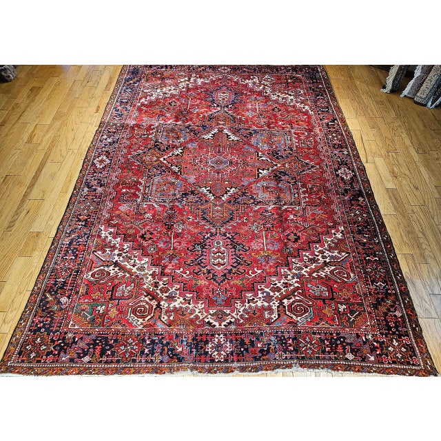 "This vintage Persian Heriz rug from the early 1900s. Woven in Northwest Persia, this rug features a classic geometric...