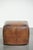 This unique and large sheepskin design ottoman features beautiful colors and a lovely patina. A footstool, also known as a...