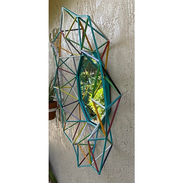 Funky hand-crafted geometric wall mirror. This isn't just a mirror; it’s a sculptural focal point that blends industrial...