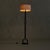 A mid-century French floor lamp, circa 1950s, in the manner of Jean-Pierre Ryckaert. Forged in darkened metal, the...