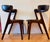 Very good pair of Fire armchairs attributed to Kai Kristiansen in dark brown teak and black leather. Leather in good...