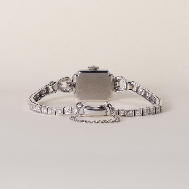 14K White Gold | Circa 1920s A refined expression of Art Deco glamour, this exceptional Lady Hamilton cocktail watch dates...