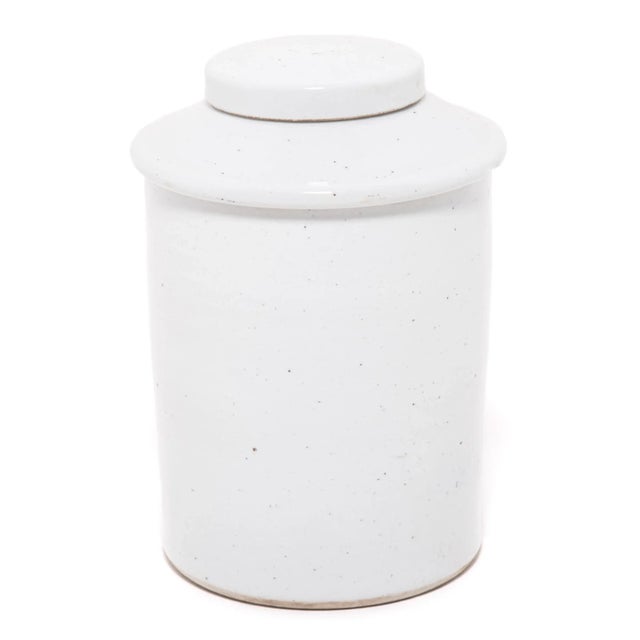Rendered in a striking white glaze, this contemporary porcelain jar offers a modern take on a Classic form. Lidded jars...