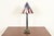 A gorgeous Arts & Crafts style table lamp USA, Circa Late 20th Century Patinated metal base, with American Flag stained...
