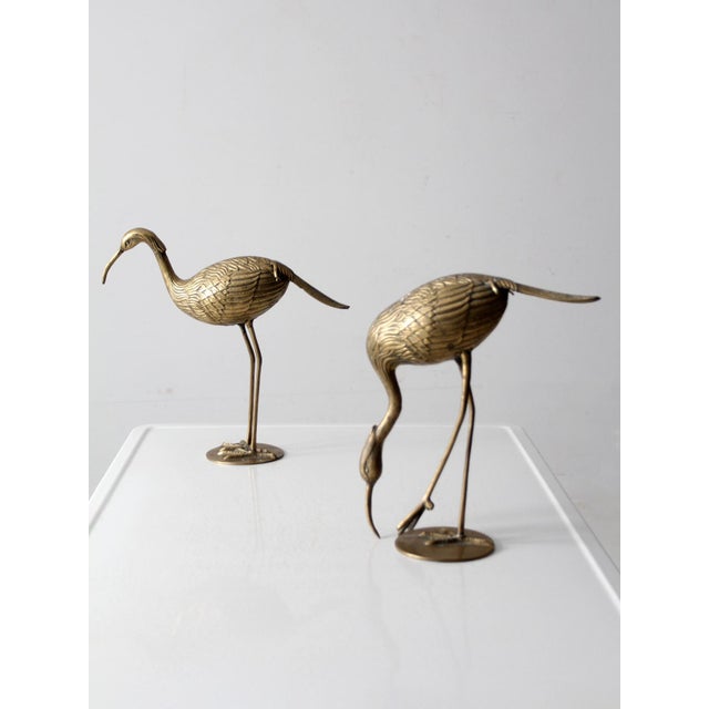 Add a touch of timeless sophistication to any space with this striking pair of mid-century brass heron figurines. Their...