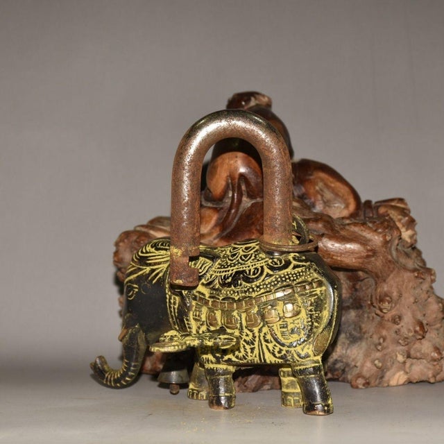 Add a touch of Eastern mysticism and bohemian charm to your space with this striking Nepalese Brass Elephant Padlock....