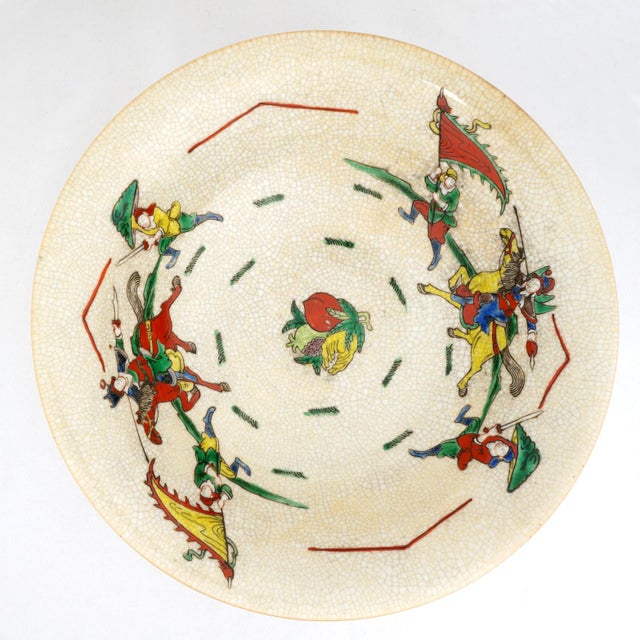 A substantial hand-painted Chinese bowl featuring a classic oatmeal crackle glaze accented by "faux bronze" detailing. The...