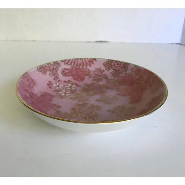 Here is a beautiful piece from a design legend! It is a porcelain bowl that is white on the outside, but gorgeously...