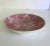 Here is a beautiful piece from a design legend! It is a porcelain bowl that is white on the outside, but gorgeously...