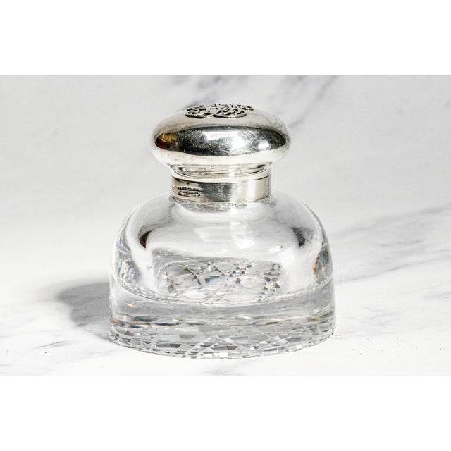 Dating to 1902, this exceptional English inkwell is a beautiful marriage of brilliant cut crystal and finely crafted...