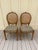 Set of 4 whimsical vintage faux bois dining chairs with caned backs. The chairs feature beautifully carved faux bois /...