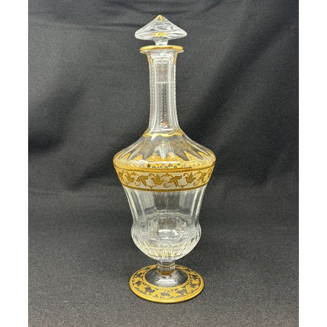 Vintage Saint-Louis Crystal Decanter Heavy gilded gold flora design on the center and base, textured background. Gold...