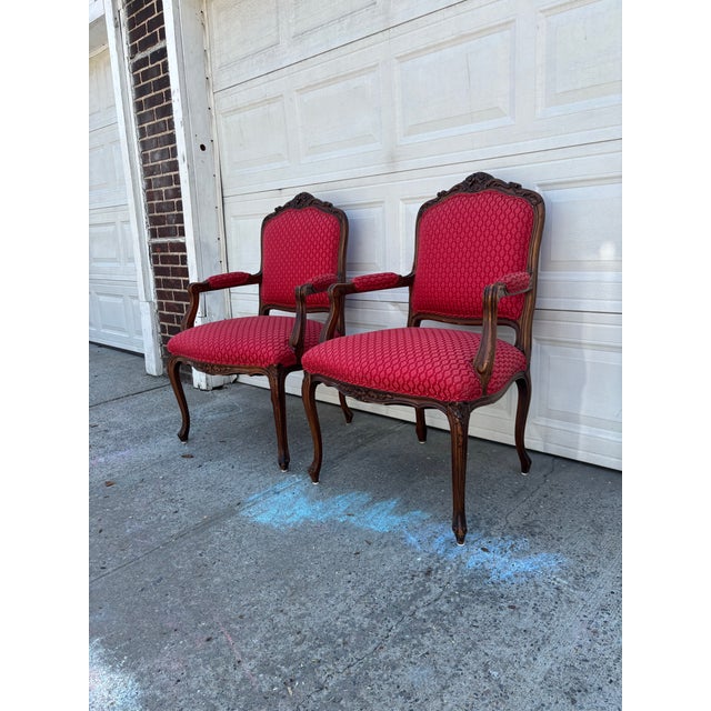 We have a beautiful pair of vintage French Louis XV style armchairs for sale, featuring elegant carved wood frames and...