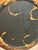 An elegant vintage French tole cachepot featuring a rich deep black finish accented with hand-painted gilt floral and...