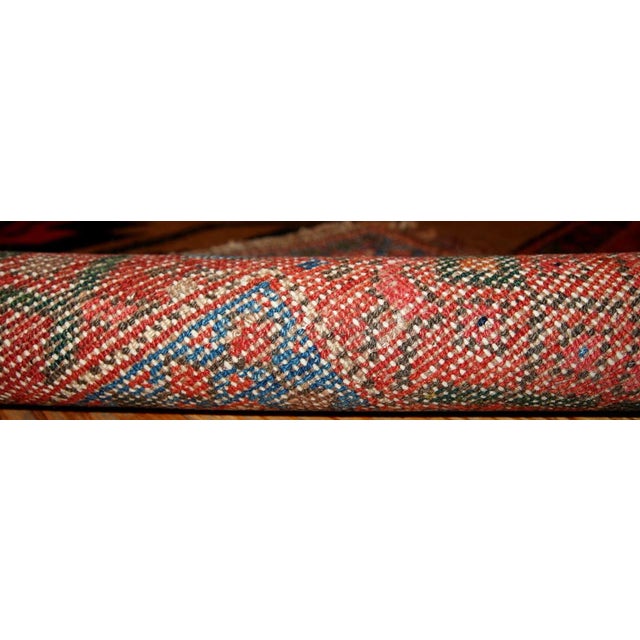 Antique Persian Kurdish rug in light brown background colour. Very primitive tribal design with large ornaments. The rug...