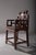 This splendid Chinese chair in the Qing style stands out for its richness of details and the elegance of its...