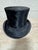 Fabulous authentic black top hat made in England by Sinclair & Co. Excellent vintage condtion and very wearable if you...