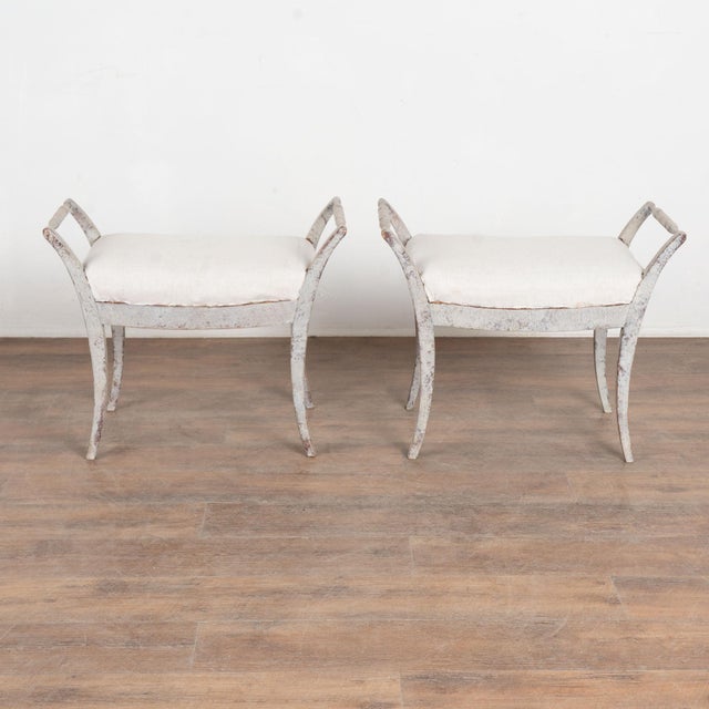 This lovely set of Swedish stools or tabourets have graceful, slightly curved legs which add an elegant touch to the pair....