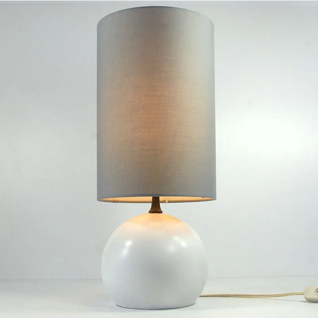 A very impressive, small table or bedside lamp designed in the Space Age style. The base is made of white lacquered metal....