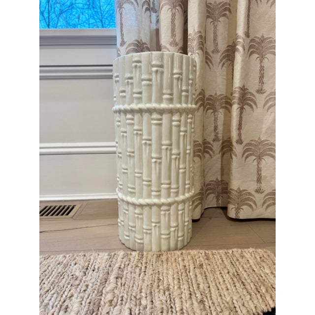 Chic umbrella stand made out of glazed white ceramic with a faux bamboo design. Unlike some of the cheap imitations, this...