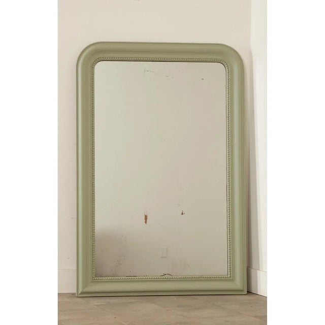 This classic Louis Philippe mirror from the 19th century (with signature arched design across the top) has been recently...