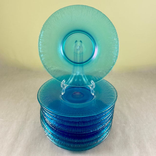 A set of twelve luncheon sized plates, Celeste Blue Iridescent Stretch Glass, the Fenton Glass Company, circa 1920-1930....