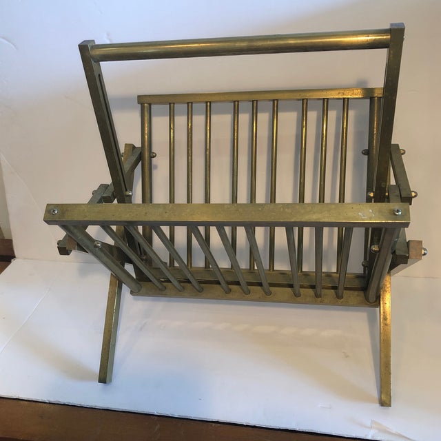Brass magazine rack that folds for storage but looks beautiful open. Made in the 1980s.