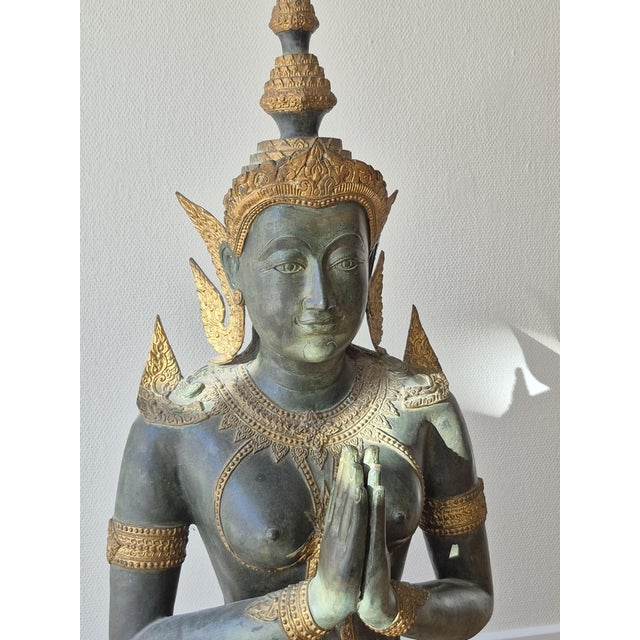 Large Southeast Asian bronze devotional sculpture from the 1950s, executed with exceptional detail and presence. The...