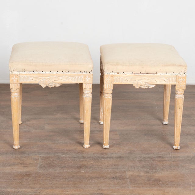 Pair of early 20th century Swedish taboret stools crafted in pine. Each stool features turned, tapered, fluted legs and...