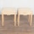 Pair of early 20th century Swedish taboret stools crafted in pine. Each stool features turned, tapered, fluted legs and...