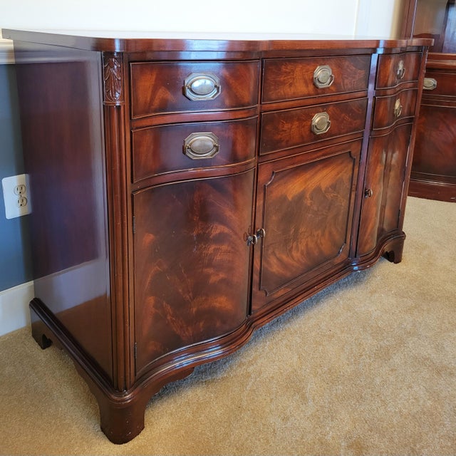 Gorgeous midsize buffet by Morganton Furniture of North Carolina, featuring a serpentine front, inscribed details along...
