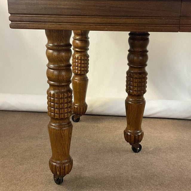 Vintage Home is pleased to present this Antique English Oak Farmhouse Dining Table from the 1800s. The table features five...