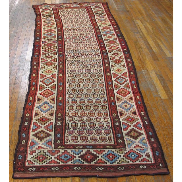 Antique Persian Tribal rug. Size: 3'6" x 10'0". Antique Kurdish Persian Ivory 1900s Rug, Circa Date: 1900s. This...