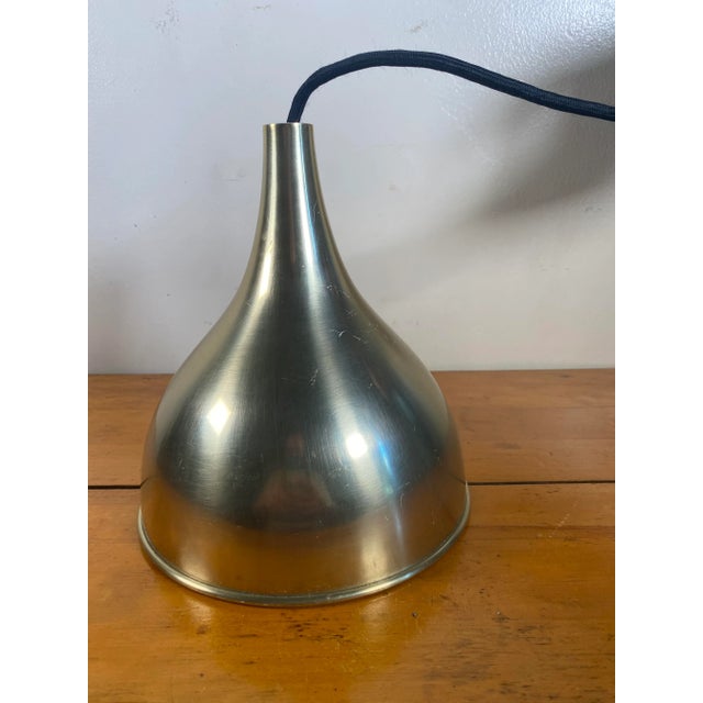 A large 'Silhuet 2' pendant lamp by Jo Hammerborg. Organically-shaped aluminium shade alloyed with brass. Manufactured by...