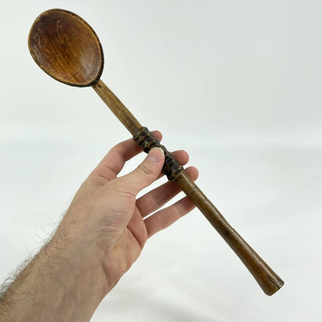 Zulu spoon from the early - mid 20th century. Dark, natural, worn patina. Zulu spoons were carved by men only, out of a...