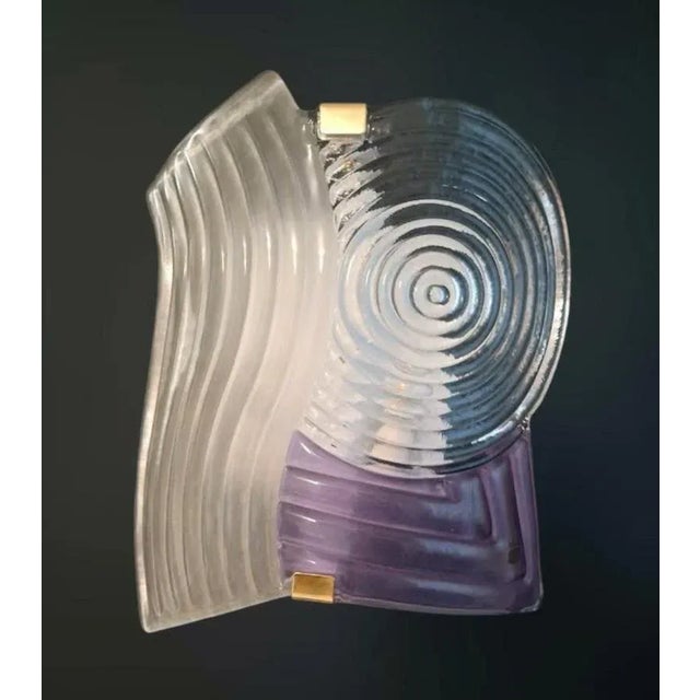 Vintage Italian wall light with a large clear and amethyst Murano glass shade hand blown in grooved texture / Made in...