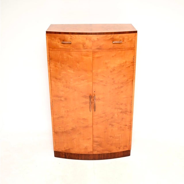 A spectacular original Art Deco satin birch and walnut compactum wardrobe. This was made in England, it dates from the...