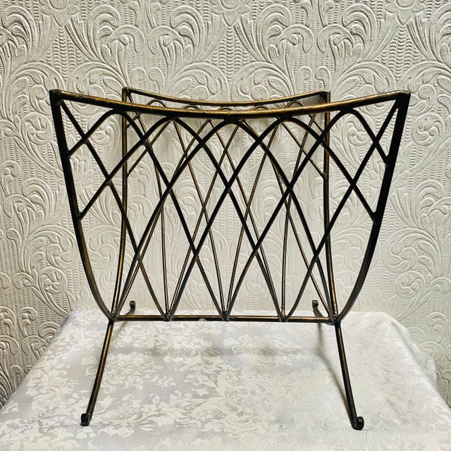 Vintage MCM Mid Century Modern Atomic Gold Metal Magazine Rack measuring 13” x 13” x 14”.