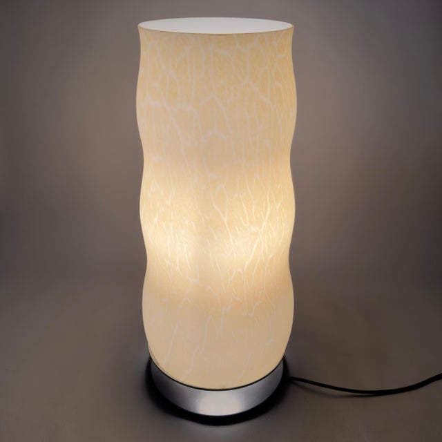 This imposing luminous work represents a perfect blend of the centuries-old tradition of Venetian glassmaking and cutting-...