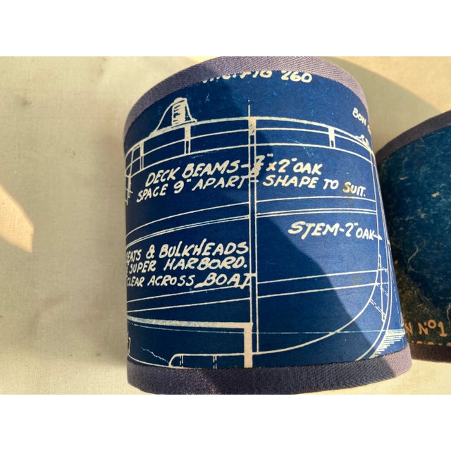 A pair of clip top sconce shades hand made from a set of vintage blueprint drawings of a ship. A perfect accent for a...