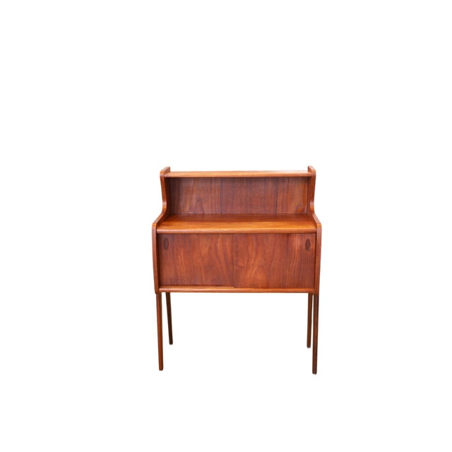Elegant and at the same time canadian teak chest/cabinet with sliding doors that give the furniture a warm, stylish and...