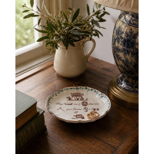 A charming late 20th century porcelain catchall by Mottahedeh, made in Portugal and decorated with a whimsical garden-...