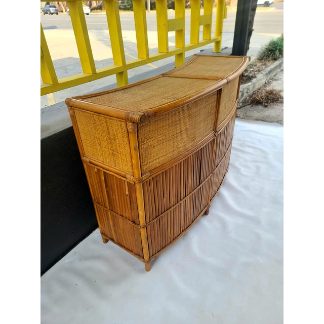 Swanky Curved Bamboo Tiki Bar with Caned top and accents with lots of storage! Great scale and look makes entertaining a...