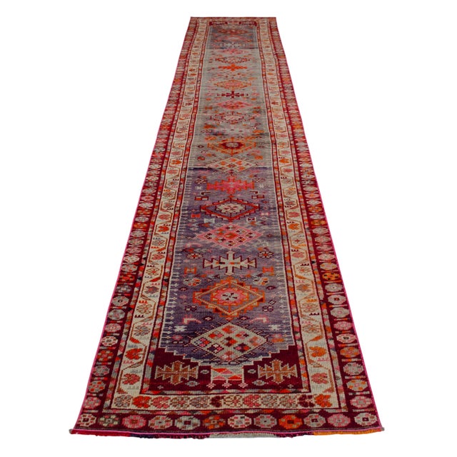 Hand-knotted in Eastern Anatolia during the 1930s, this exceptional antique runner embodies the region's rich weaving...