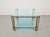 This elegant T24 coffee table/side table, designed by Peter Ghyczy in the 1970s, features the original brass legs made by...