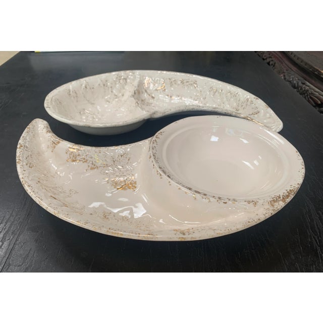 Mid-century modern, Yin and Yang shaped serving dishes in gold speckled ivory white. The set of 2 serving platters was...